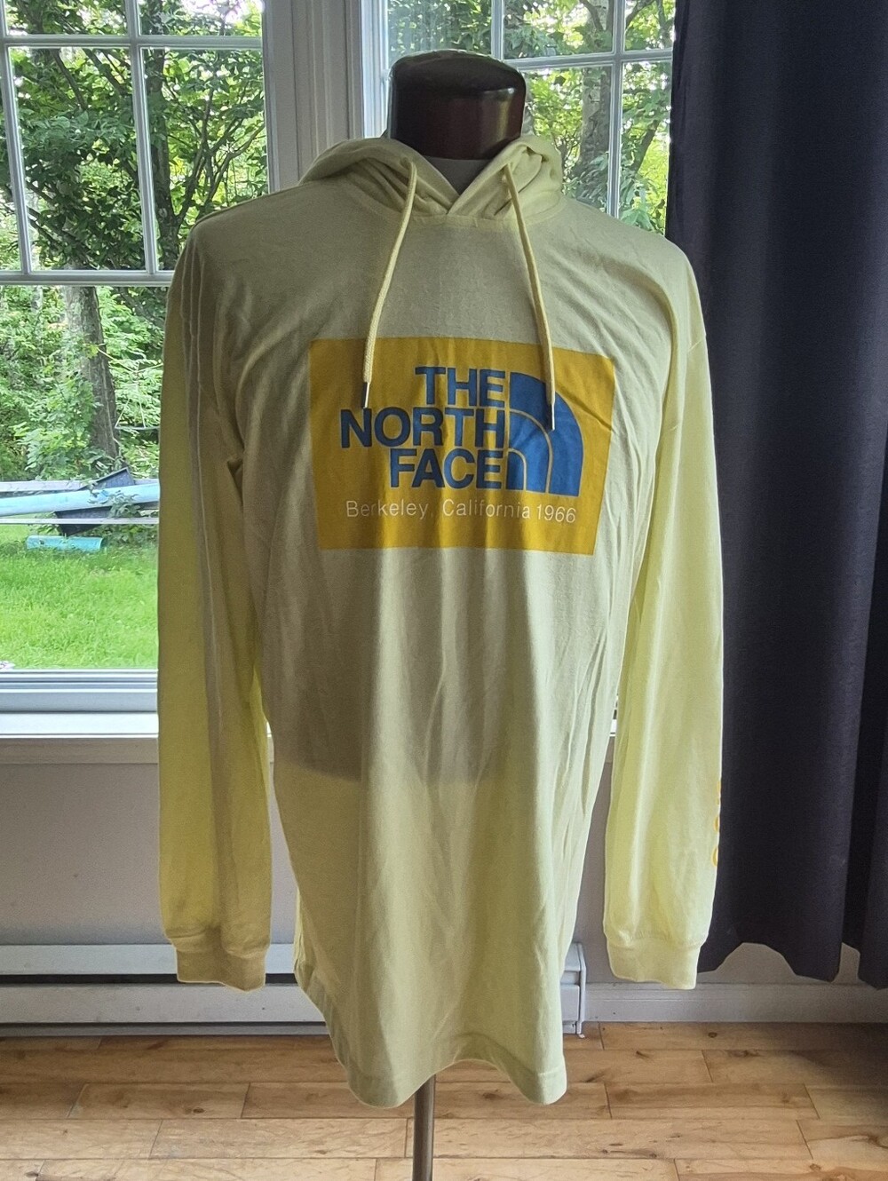 The North Face Pale Yellow Pullover Hoodie with Blue Logo